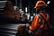 Man in helmet and safety vest in steel factory