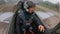 A man in helmet student in a flight school for the first time sits in gray real plane. Pilot shows different gestures. Inside view