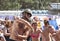 Man in helmet taking part in tomato fight.