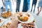 Man helping himself on Buffet of party outdoors taking food