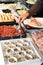 Man helping himself to food on a buffet