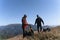 Man helping paragliding pilot to prepare for flight.