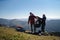 Man helping paragliding pilot to prepare for flight.