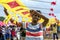 A man helps to hold a Japanese kite on Negombo beach in Sri Lanka.