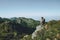 Man hiker alone at mountains enjoying landscape