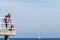 Man hiker with backpack on pier, sea landscape