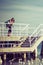 Man hiker with backpack on pier, sea landscape