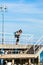 Man hiker with backpack on pier, sea landscape