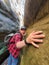 man hiker with backpack in tight canyon