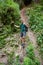 Man hiker holding on to a safety cable