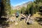 Man hiker looks at the mountains where he has to get