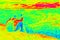 Man hiker sitting in nature. Infrared thermal radiation