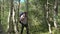 Man Hiking in an Aspen Forest Wearing a Backpack