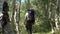 Man Hiking in an Aspen Forest Wearing a Backpack