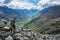 Man hiking down steep trail in the Talkeetna Mountains, Alaska