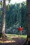 Man in hiking outfit admiring panorama of cliff alone