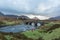 Man hiking through Scottish Highlands