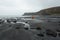 Man hiking through Scottish Highlands along rugged coastline