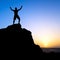 Man hiking success silhouette in mountains