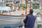 Man in His 50s or 60s Probably Retired Painting a Traditional Majorcan Boat