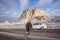 man on his adventure going to beautiful hill in cappadocia in winter by his car