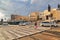 A man with his daughter cross the street in Jerusalem