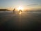 man and his reflection at sunset on the beach