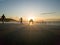 man and his reflection at sunset on the beach