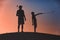 Man with his son golfers silhouette