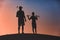 Man with his son golfers silhouette