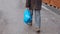 Man hoding blue plastic bags. Closeup view, copy space