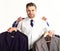 Man hold hangers with classic clothes. Businessman chooses outfit