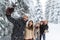 Man Hold Smart Phone Camera Taking Selfie Photo Friends Smile Snow Forest Young People Group Outdoor