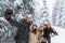 Man Hold Smart Phone Camera Taking Selfie Photo Friends Smile Snow Forest Young People Group Outdoor