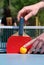 Man hold the tennis racket on pingpong table