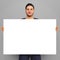 Man holding 24 x 36 canvas blank copy space selling art photo enlargement 3D illustration