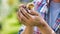 Man holding a baby chick in his hands very carefully