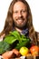 Man holding a bag of fresh fruit and vegetables