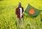 Man holding a Bangladeshi flag standing