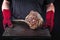 Man is holding barbecue wagyu tomahawk beef steak on old metal sheet in his hands