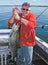 Man Holding Big Lake Ontario King Salmon Fish