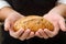 Man holding a boule bread