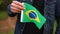 Man holding brazilian flag outdoors. Independence Day, or national holidays concepts