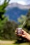 Man holding calabash yerba mate in nature. Travel and adventure concept. Latin American drink yerba mate