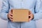 Man holding cardboard box. Delivery service. close up. copy space. mockup