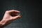 Man holding a coins. Euro currency on a black background. HandÂ´s of young man holding a money. Finance and banking concept.