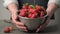 Man holding colander with fresh ripe strawberries