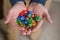 Man Holding Colorful Polyhedral Dice Playing Dungeons and Dragons