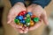 Man Holding Colorful Polyhedral Dice Playing Dungeons and Dragons