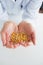 Man holding corn grain in his hands